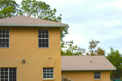 House exterior photo in Miami with a shingle roof