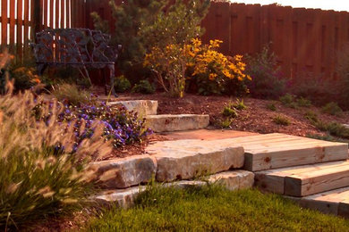 Photo of a large full sun backyard mulch landscaping in Omaha.