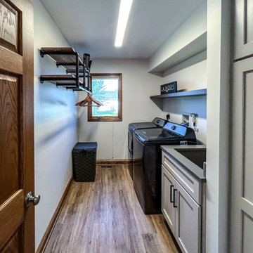 Laundry Room with Custom Cabinetry Quartz Countertop and Custom Floating Shelf
