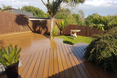 Design ideas for a medium sized contemporary back partial sun garden for summer in Other with decking.