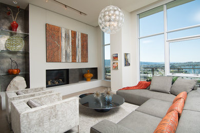 Inspiration for a contemporary medium tone wood floor living room remodel in Portland with white walls, a standard fireplace and a metal fireplace