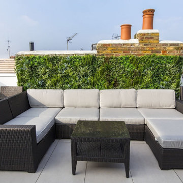 Relaxing Oasis on Rooftop with Artificial Green Walls