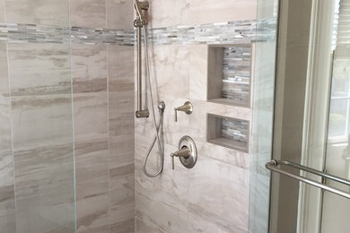Inspiration for a timeless master beige tile, gray tile and ceramic tile walk-in shower remodel in Atlanta with beige walls and a hinged shower door