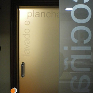 Mid-sized modern kitchen pantry designs - Example of a mid-sized minimalist u-shaped kitchen pantry design in Other with an integrated sink, quartz countertops and an island