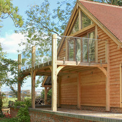 Double height oak posts leading out from a room above barn - Posts, Railings and Ballustrades