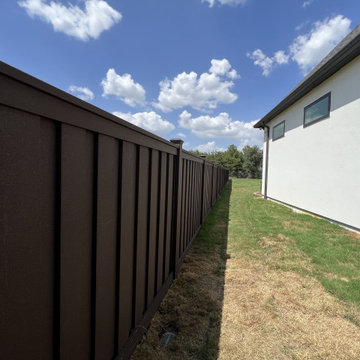 Dark Brown Composite Trex Fence and Black Iron Fence