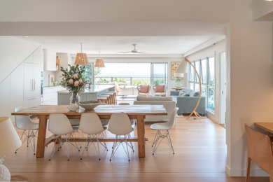 This is an example of a beach style dining room in Sunshine Coast.