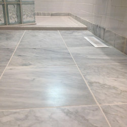 Carrara marble guest bathroom floor with stone solid surface low threshold showe - Bath Products