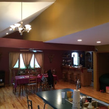 Open kitchen, dining area, and home bar