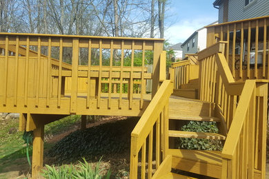 Inspiration for a large backyard deck remodel in Cincinnati with no cover
