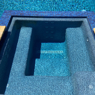 Backyard Paradise Geometric Pool and Flush Spa