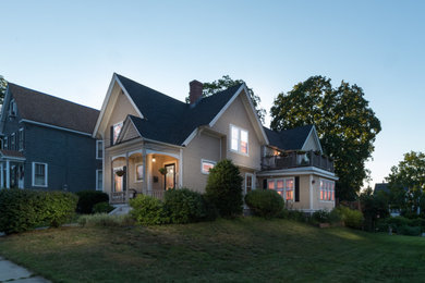 Craftsman beige two-story wood exterior home idea in Boston with a shingle roof