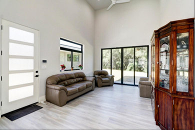 Minimalist family room photo in Sacramento