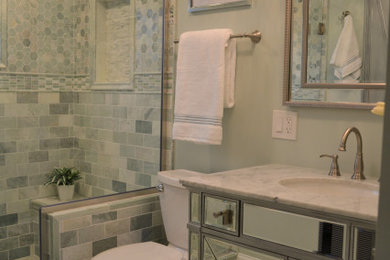 Bathroom - small contemporary master marble tile marble floor, green floor and single-sink bathroom idea in Baltimore with a one-piece toilet, an undermount sink, quartzite countertops, white countertops and a freestanding vanity