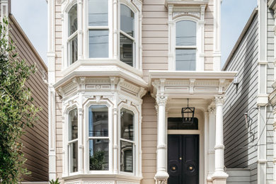 Inspiration for a traditional three-storey brown house exterior in San Francisco with wood siding.