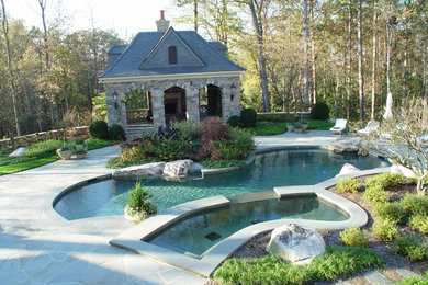 Pool house - mid-sized rustic backyard stone and custom-shaped natural pool house idea in Atlanta