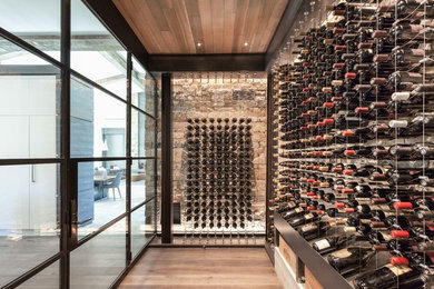Large minimalist medium tone wood floor wine cellar photo in Sacramento