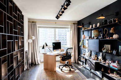 Home office - modern dark wood floor home office idea in Chicago with black walls