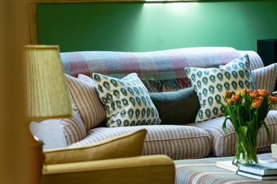 Inspiration for a large farmhouse formal open plan living room curtain in Sussex with green walls, carpet, a wall mounted tv, beige floors and a timber clad ceiling.