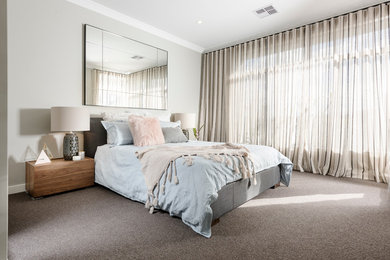 This is an example of a contemporary master bedroom in Perth with carpet.