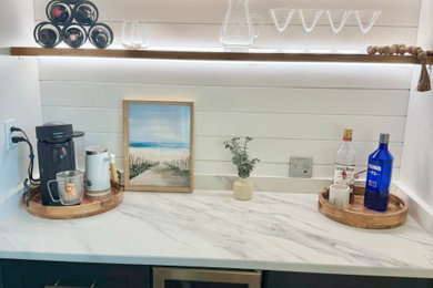 Small minimalist single-wall dry bar photo in Tampa with shaker cabinets, dark wood cabinets, quartz countertops, white backsplash, quartz backsplash and white countertops