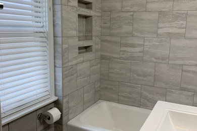 Bathroom - small contemporary master gray tile and porcelain tile porcelain tile, gray floor and single-sink bathroom idea in Chicago with a two-piece toilet, gray walls and a pedestal sink