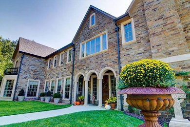 Inspiration for a huge rustic entryway remodel in Austin with a medium wood front door