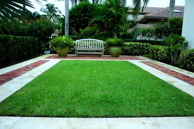 Inspiration for a mid-sized traditional full sun courtyard brick outdoor basketball/tennis/multi-game court in Miami.