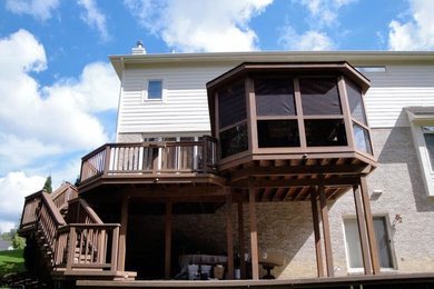 Deck - large backyard deck idea in Detroit with no cover