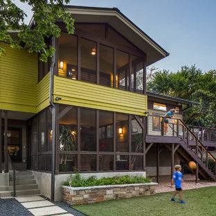 Inspiration for a timeless green split-level concrete fiberboard exterior home remodel in Austin