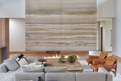 Southwest open concept limestone floor, beige floor, wood ceiling and wood wall living room photo in Phoenix with a bar, white walls, a two-sided fireplace and no tv