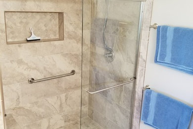 Design ideas for a large transitional master bathroom in Portland with beige tile and porcelain tile.