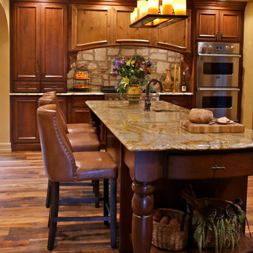 Mediterranean Luxury Kitchen Remodel | Stone Accents & Arched Detailing