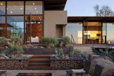 Inspiration for a southwestern patio remodel in Phoenix with a fire pit