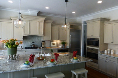 Large trendy l-shaped medium tone wood floor eat-in kitchen photo in Richmond with shaker cabinets, white cabinets, granite countertops, white backsplash, porcelain backsplash, stainless steel appliances and an island