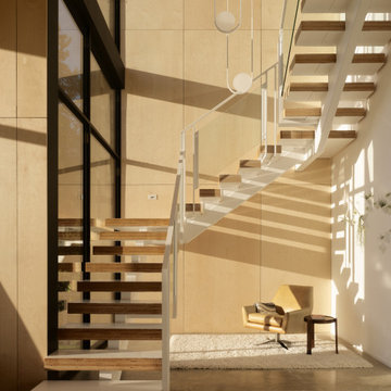 Lower-level switchback floating stair - Fold House Berkeley Hills