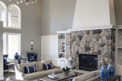 Inspiration for a large transitional open concept carpeted and gray floor living room library remodel in Phoenix with gray walls, a standard fireplace, a stone fireplace and no tv