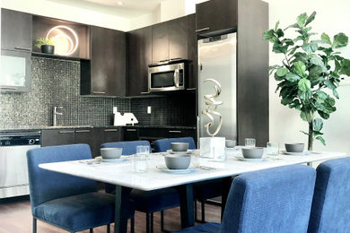 Kitchen/dining room combo - mid-sized modern dark wood floor, brown floor and vaulted ceiling kitchen/dining room combo idea with white walls and no fireplace