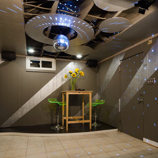 Inspiration for a medium sized contemporary look-out basement in Richmond with multi-coloured walls, terracotta flooring and no fireplace.