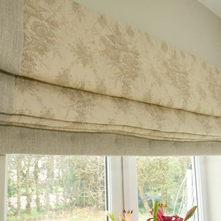 Example of a cottage chic home design design in Surrey