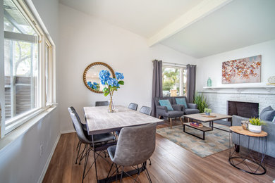 Example of a mid-sized trendy light wood floor dining room design in Los Angeles