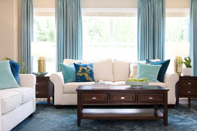 Living room - mid-sized transitional formal and enclosed medium tone wood floor and brown floor living room idea in Raleigh with beige walls, no fireplace and no tv