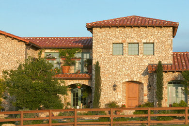 Inspiration for a mediterranean exterior home remodel in Austin