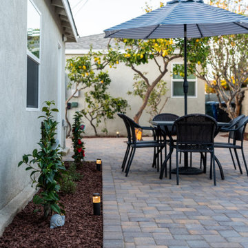 Paver Patio Dining Area with Garden Path Lighting | Manhattan Beach Backyard