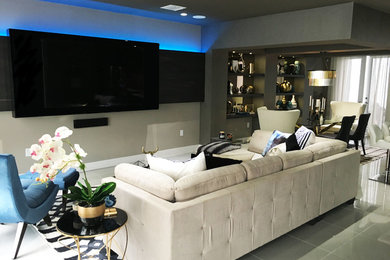 Living room - mid-sized contemporary open concept porcelain tile and gray floor living room idea in Miami with gray walls, no fireplace and a media wall