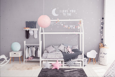 Photo of a mid-sized scandinavian gender-neutral kids' room in Melbourne with grey walls, painted wood floors and white floor.