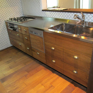 Small mediterranean kitchen pantry ideas - Kitchen pantry - small mediterranean u-shaped dark wood floor and brown floor kitchen pantry idea in Fukuoka with a single-bowl sink, brown cabinets, stainless steel countertops, white backsplash, stone tile backsplash, stainless steel appliances and brown countertops