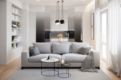 Esempio di un piccolo soggiorno minimalista aperto con pareti grigie, parquet chiaro e TV a parete