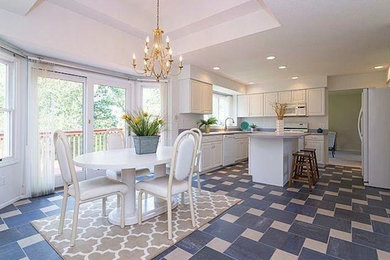 Inspiration for a large transitional ceramic tile kitchen/dining room combo remodel in Detroit with white walls and no fireplace