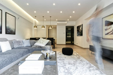 Design ideas for a medium sized formal and grey and white open plan living room in Manchester with white walls, ceramic flooring, a wall mounted tv, white floors and feature lighting.
